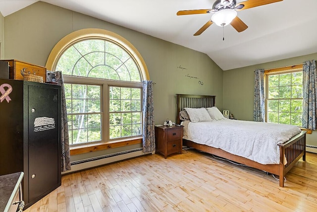 52 Casey Rd, Windsor, ME 04363 - bedroom with baseboard heating, lofted ceiling, light wood finished floors, and a ceiling fan