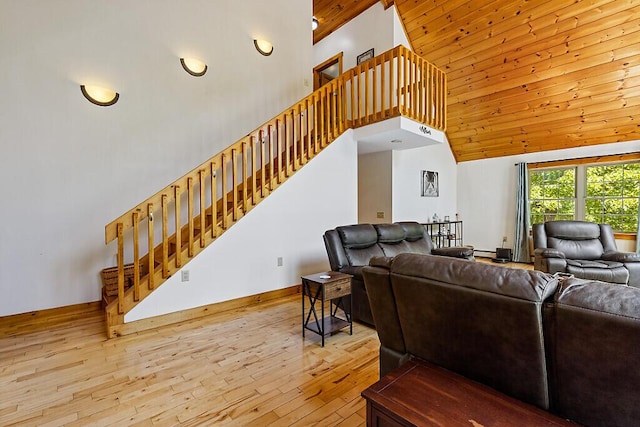 52 Casey Rd, Windsor, ME 04363 - living area with a towering ceiling, hardwood / wood-style floors, stairway, and wooden ceiling