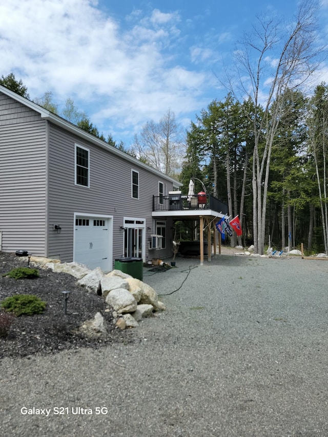 313 Nevells Way, Ellsworth, ME 04605 - rear view of property with a deck and an attached garage