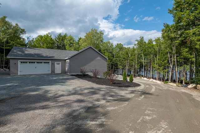 313 Nevells Way, Ellsworth, ME 04605 - view of side of home with a garage and asphalt driveway