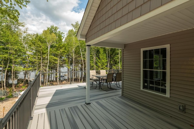 313 Nevells Way, Ellsworth, ME 04605 - wooden deck featuring outdoor dining area and view of wooded area
