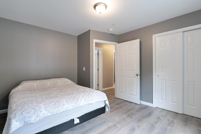 313 Nevells Way, Ellsworth, ME 04605 - bedroom featuring light wood finished floors, a closet, and baseboards