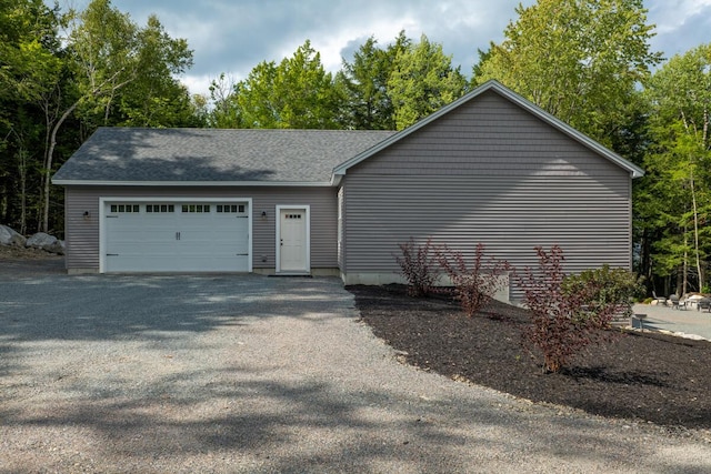 313 Nevells Way, Ellsworth, ME 04605 - view of side of home featuring roof with shingles and an attached garage