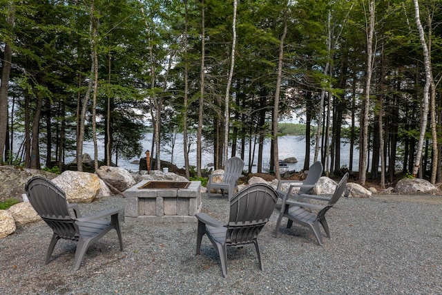 313 Nevells Way, Ellsworth, ME 04605 - view of patio / terrace with a fire pit and a water view