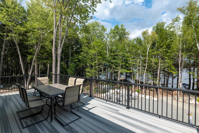 313 Nevells Way, Ellsworth, ME 04605 - wooden deck featuring outdoor dining area and view of wooded area