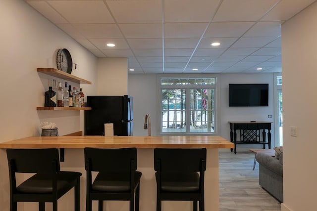 313 Nevells Way, Ellsworth, ME 04605 - indoor bar with freestanding refrigerator, plenty of natural light, a paneled ceiling, and recessed lighting
