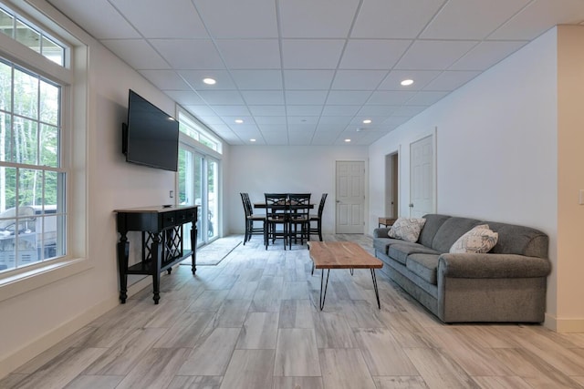313 Nevells Way, Ellsworth, ME 04605 - living room featuring a paneled ceiling, recessed lighting, light wood-style floors, and baseboards
