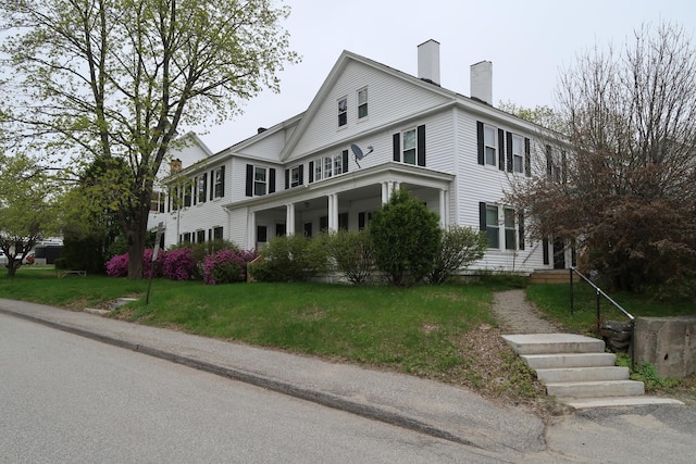 11 Green St, Winthrop, ME 04364 - view of side of home featuring a chimney and a lawn