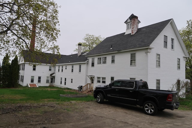 11 Green St, Winthrop, ME 04364 - back of house featuring a chimney