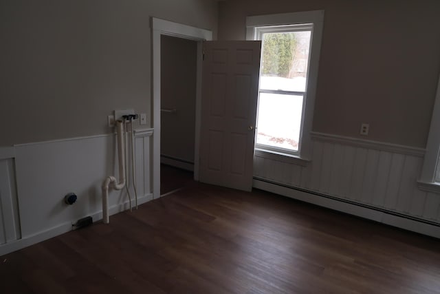 11 Green St, Winthrop, ME 04364 - unfurnished room featuring wood finished floors, baseboard heating, and a wainscoted wall