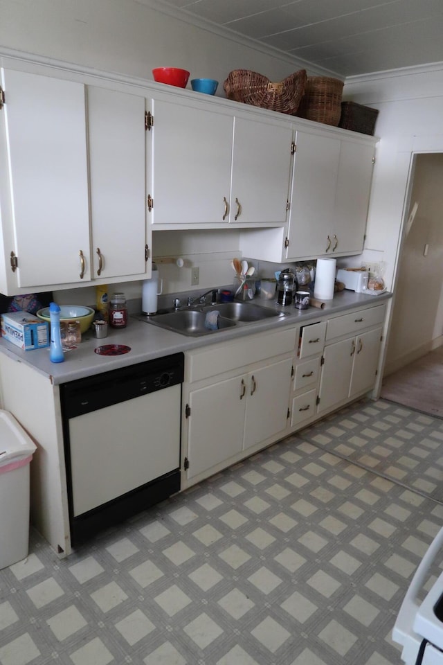 11 Green St, Winthrop, ME 04364 - kitchen featuring dishwasher, a sink, light countertops, white cabinetry, and ornamental molding