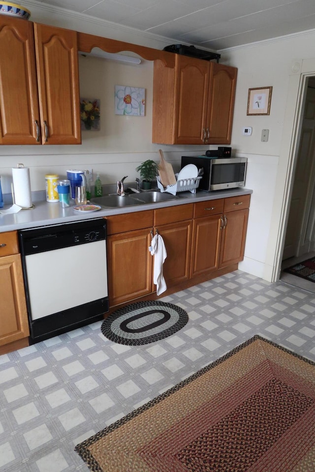 11 Green St, Winthrop, ME 04364 - kitchen featuring white dishwasher, a sink, stainless steel microwave, and brown cabinetry