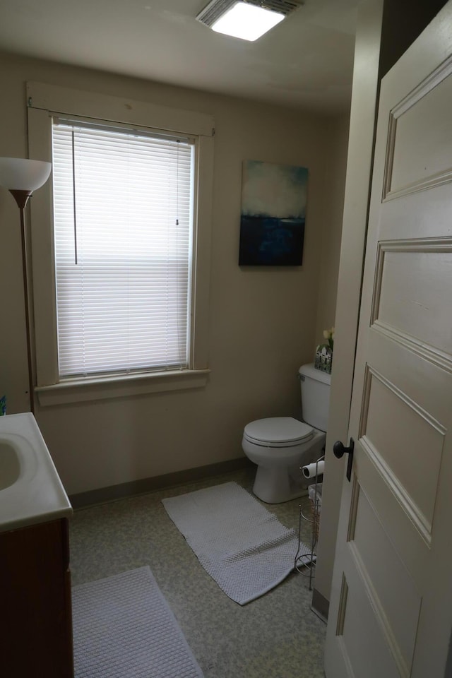 11 Green St, Winthrop, ME 04364 - bathroom with toilet, vanity, and baseboards
