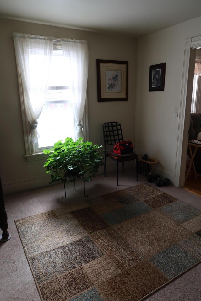 11 Green St, Winthrop, ME 04364 - living area featuring healthy amount of natural light and carpet