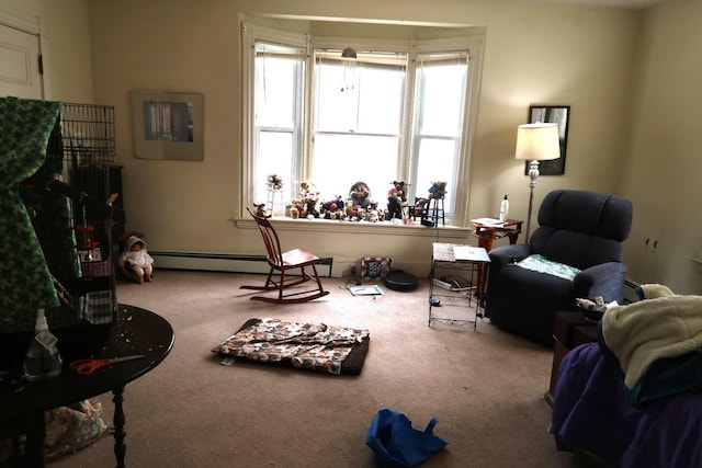 11 Green St, Winthrop, ME 04364 - carpeted living room with a baseboard radiator