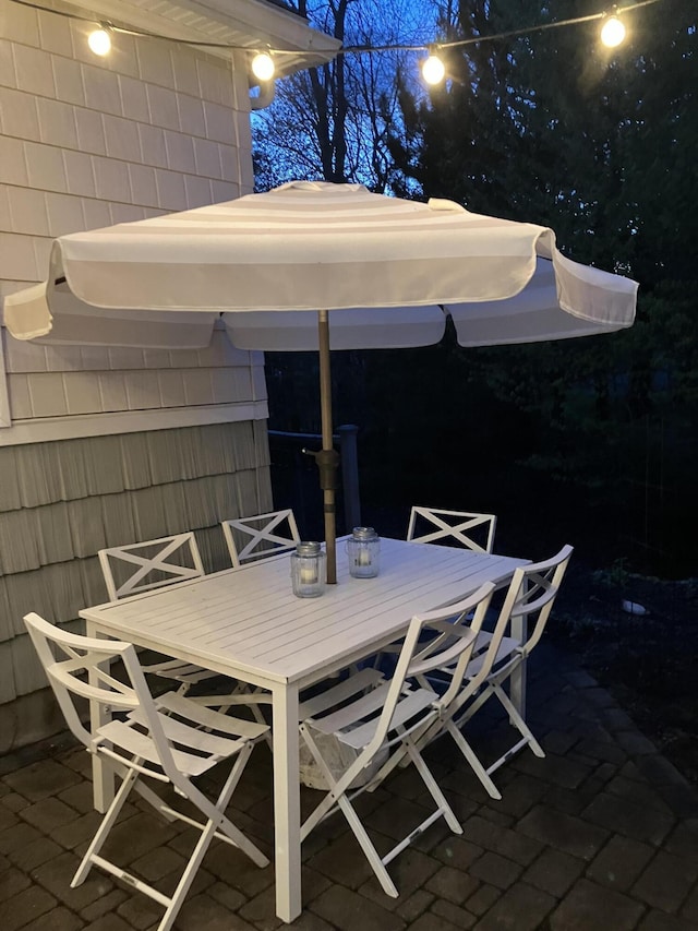 patio at twilight with outdoor dining space