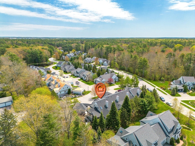 aerial view of residential area with a forest