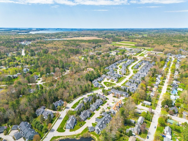aerial view of property and surrounding area featuring nearby suburban area