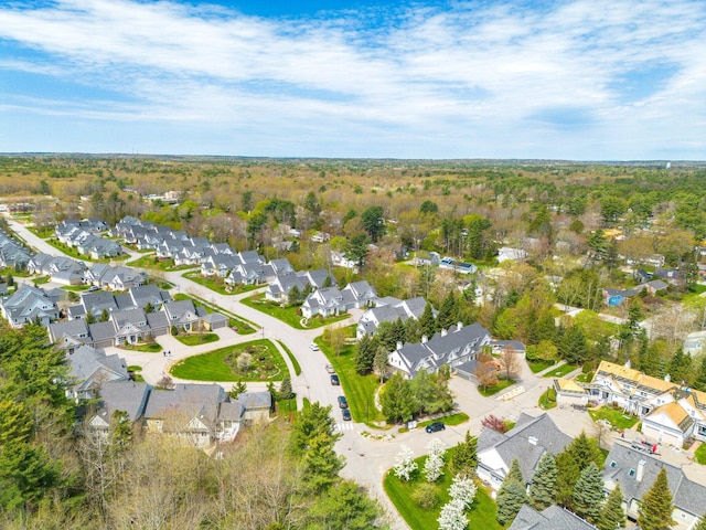 aerial view of property and surrounding area with nearby suburban area
