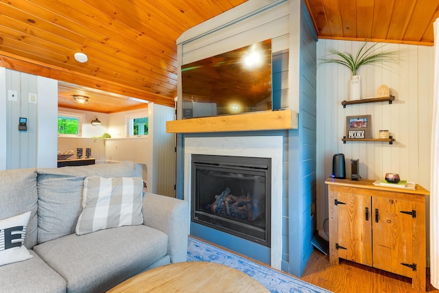 61 Beechwoods Rd, Oxford, ME 04270 - living room with wood ceiling, wood finished floors, and a glass covered fireplace