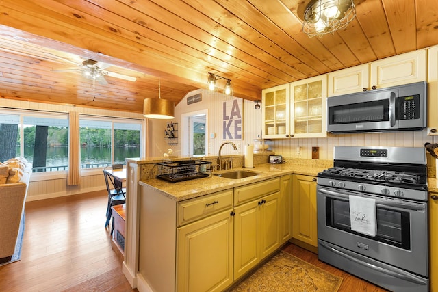 61 Beechwoods Rd, Oxford, ME 04270 - kitchen with stainless steel appliances, a sink, wooden ceiling, a peninsula, and vaulted ceiling