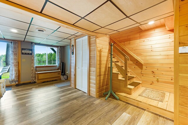 61 Beechwoods Rd, Oxford, ME 04270 - bonus room featuring hardwood / wood-style floors, wooden walls, and stairway