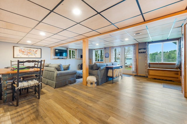 61 Beechwoods Rd, Oxford, ME 04270 - living area featuring a paneled ceiling, healthy amount of natural light, and light wood-type flooring