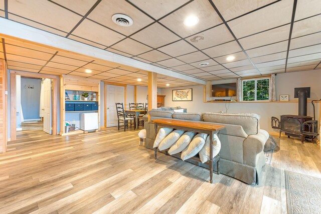 61 Beechwoods Rd, Oxford, ME 04270 - living area featuring a wood stove and wood finished floors