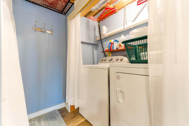 61 Beechwoods Rd, Oxford, ME 04270 - laundry area featuring washing machine and dryer, wood finished floors, and baseboards