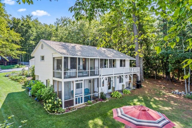 61 Beechwoods Rd, Oxford, ME 04270 - back of property featuring a sunroom, a yard, and a shingled roof