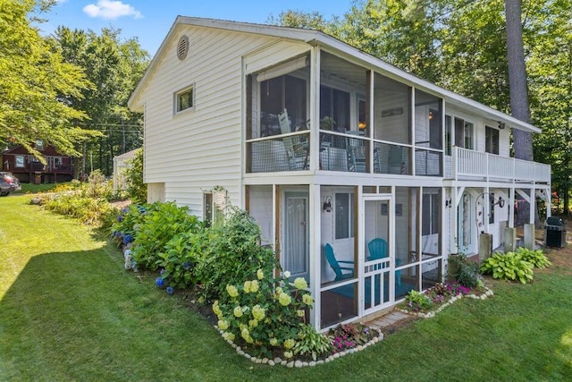 61 Beechwoods Rd, Oxford, ME 04270 - view of side of home with a sunroom and a yard