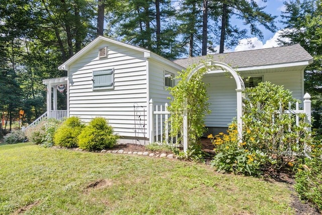 61 Beechwoods Rd, Oxford, ME 04270 - view of property exterior featuring a yard and roof with shingles