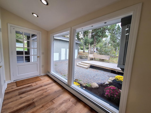 58 Back Shore Rd, Castine, ME 04421 - doorway featuring a baseboard heating unit, light wood-type flooring, recessed lighting, vaulted ceiling, and baseboards