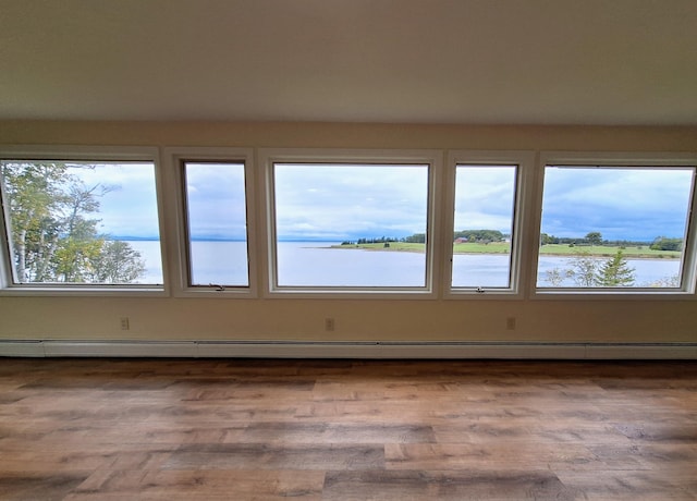 58 Back Shore Rd, Castine, ME 04421 - unfurnished room featuring a water view and a baseboard radiator