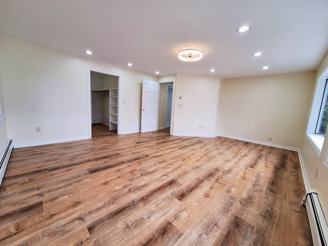 58 Back Shore Rd, Castine, ME 04421 - spare room featuring baseboard heating, recessed lighting, light wood-style flooring, baseboards, and a baseboard heating unit