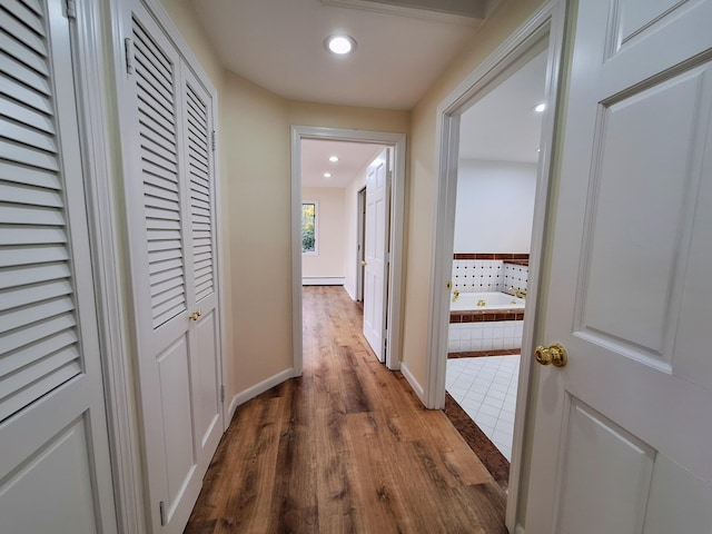 58 Back Shore Rd, Castine, ME 04421 - corridor with dark wood-type flooring, recessed lighting, baseboard heating, and baseboards