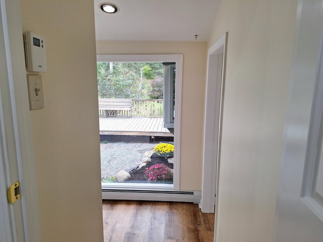 58 Back Shore Rd, Castine, ME 04421 - doorway to outside with a baseboard heating unit, wood finished floors, and recessed lighting