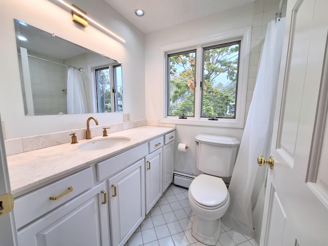 58 Back Shore Rd, Castine, ME 04421 - bathroom with baseboard heating, tile patterned floors, toilet, vanity, and recessed lighting