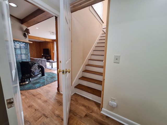 58 Back Shore Rd, Castine, ME 04421 - stairway featuring wood finished floors, a wood stove, recessed lighting, and baseboards