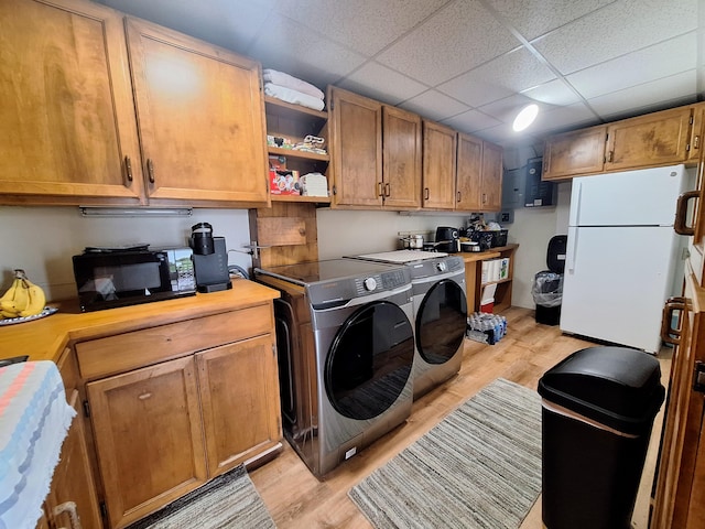 58 Back Shore Rd, Castine, ME 04421 - laundry room with light wood finished floors and washing machine and dryer