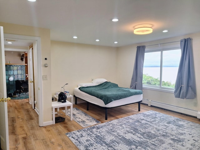 58 Back Shore Rd, Castine, ME 04421 - bedroom featuring light wood-type flooring, recessed lighting, baseboards, and baseboard heating
