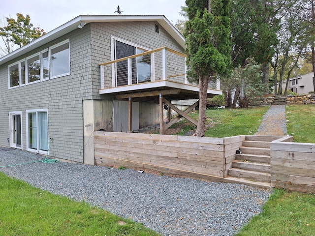 58 Back Shore Rd, Castine, ME 04421 - view of home's exterior featuring stairway and a lawn