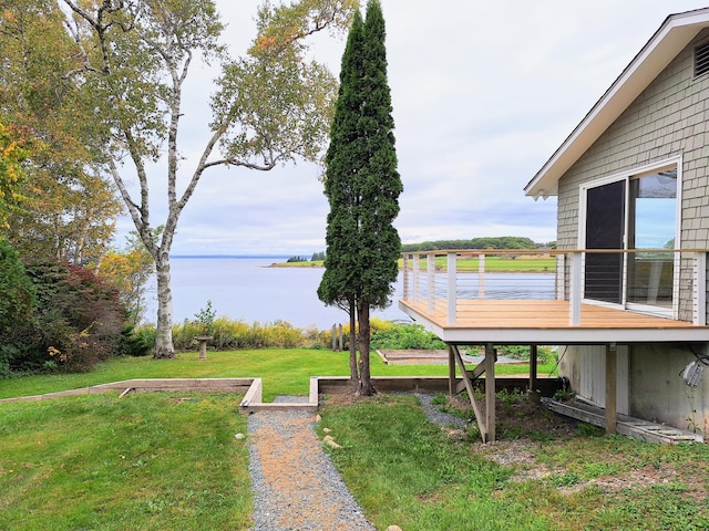 58 Back Shore Rd, Castine, ME 04421 - view of grassy yard with a deck with water view