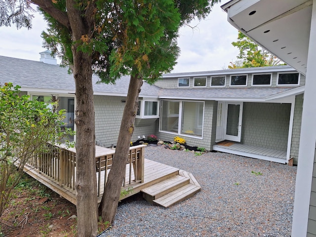 58 Back Shore Rd, Castine, ME 04421 - rear view of house with roof with shingles and a deck