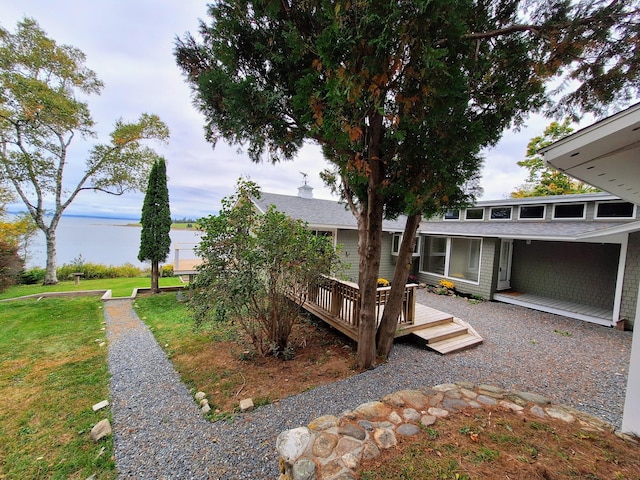 58 Back Shore Rd, Castine, ME 04421 - view of green lawn featuring a deck with water view