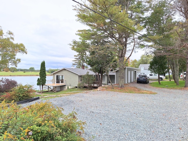 58 Back Shore Rd, Castine, ME 04421 - view of front facade featuring gravel driveway and a water view