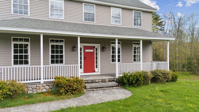 20 Motorcycle Dr, Windham, ME 04062 - view of front of property with covered porch, roof with shingles, and a front lawn
