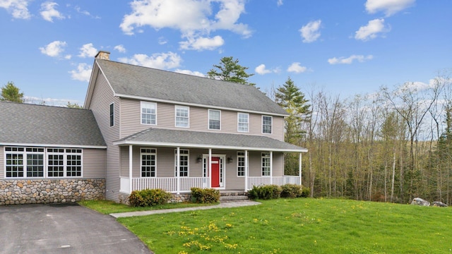 20 Motorcycle Dr, Windham, ME 04062 - colonial home featuring covered porch, a front lawn, a shingled roof, and a chimney