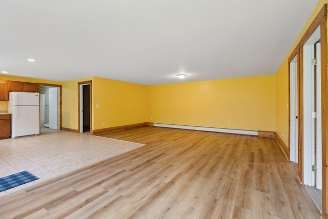 20 Motorcycle Dr, Windham, ME 04062 - unfurnished living room with a baseboard radiator, light wood-style flooring, recessed lighting, and baseboards