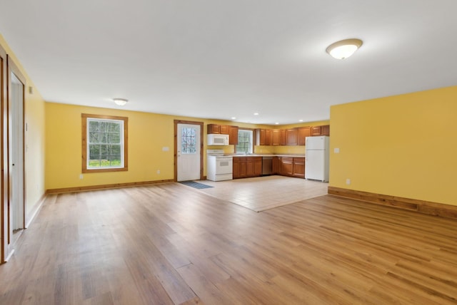 20 Motorcycle Dr, Windham, ME 04062 - unfurnished living room featuring light wood-style floors, recessed lighting, and baseboards